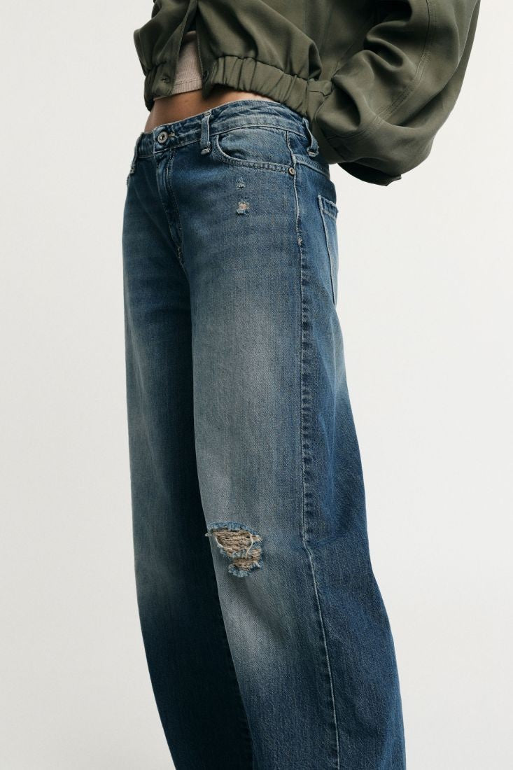 PLEASE - Jeans flare a vita bassa dettagli effetto used